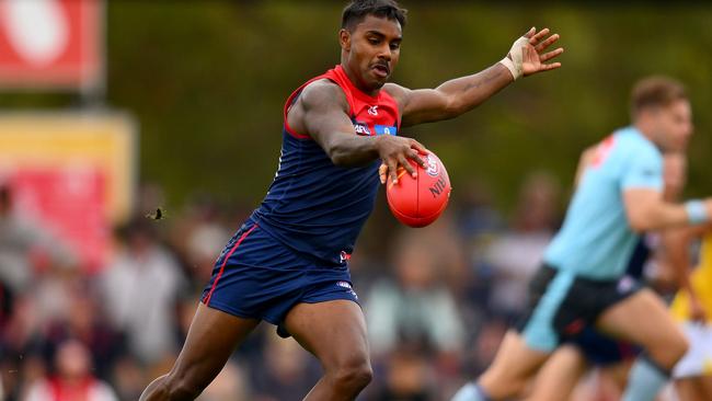 MELBOURNE, AUSTRALIA - FEBRUARY 18: Kysaiah Pickett of the Demons kicks the ball during an AFL practice match between Melbourne Demons and Richmond Tigers at Casey Fields on February 18, 2024 in Melbourne, Australia. (Photo by Morgan Hancock/Getty Images)