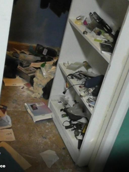 The wall cavity behind a bookshelf that Geoff Dean Freeman allegedly hid in during a search of his home on August 14. Picture: NSW Police