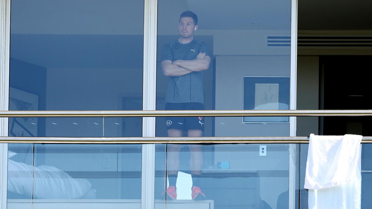 Giant Toby Greene watches the Sydney Swans train from his room where he has been forced to quarantine. Picture: Michael Klein