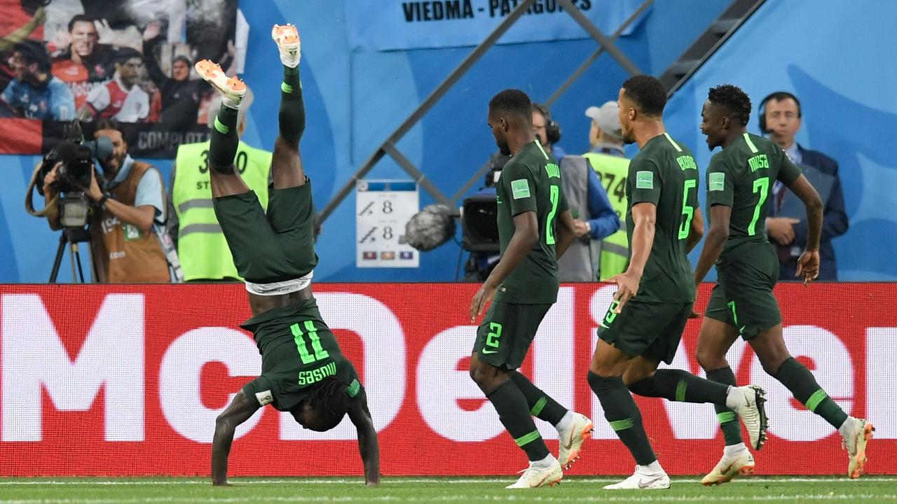 Nigeria's forward Victor Moses (L) celebrates his goal against Argentina.