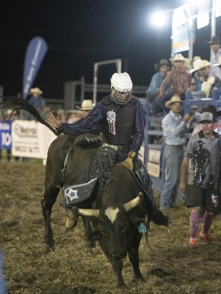 Josh Jones rides his way to a win in the top eight chute out at the Lawrence Twilight Rodeo. Picture: Adam Hourigan