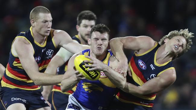 Luke Shuey and Rory Sloane dig deep while Sam Jacobs tries to get a part of the action. Picture Sarah Reed