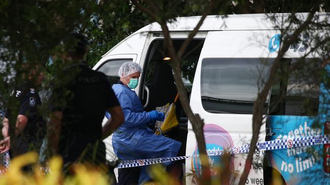 A police forensic officer inspects the van where the boy’s body was found. Picture: Brendan Radke