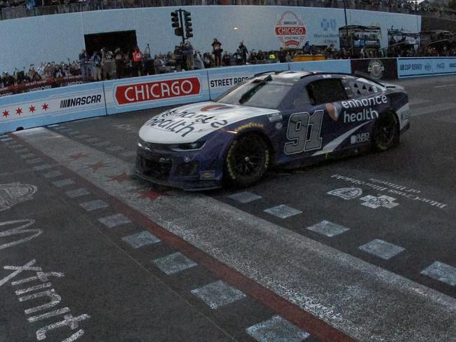 Shane van Gisbergen crosses the line for a famous win. Picture: Sean Gardner/Getty Images