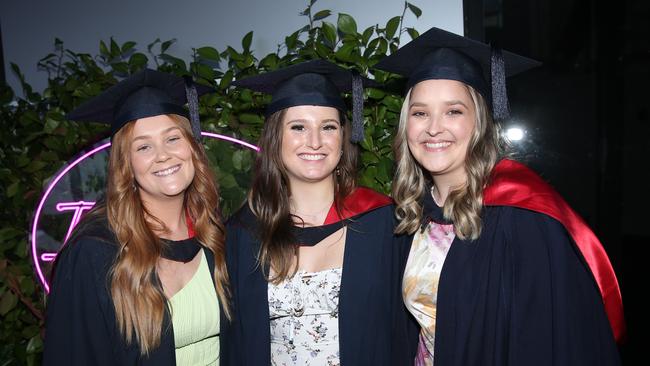 Rebecca Anstice, Hannah Whitehead and Naomi Newcombe celebrate graduation. Picture: Alan Barber