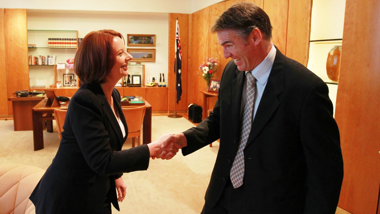 Prime Minster Julia Gillard greets independent MP Rob Oakeshott ahead of meeting with the tree Independents including Katter and Windsor at her Parliament House office in Canberra, is seeking their support in hung parliament after 2010 federal election, to retain office.