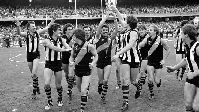 Richmond players celebrate their big win over Collingwood in 1980 before 113,461 crazed fans.