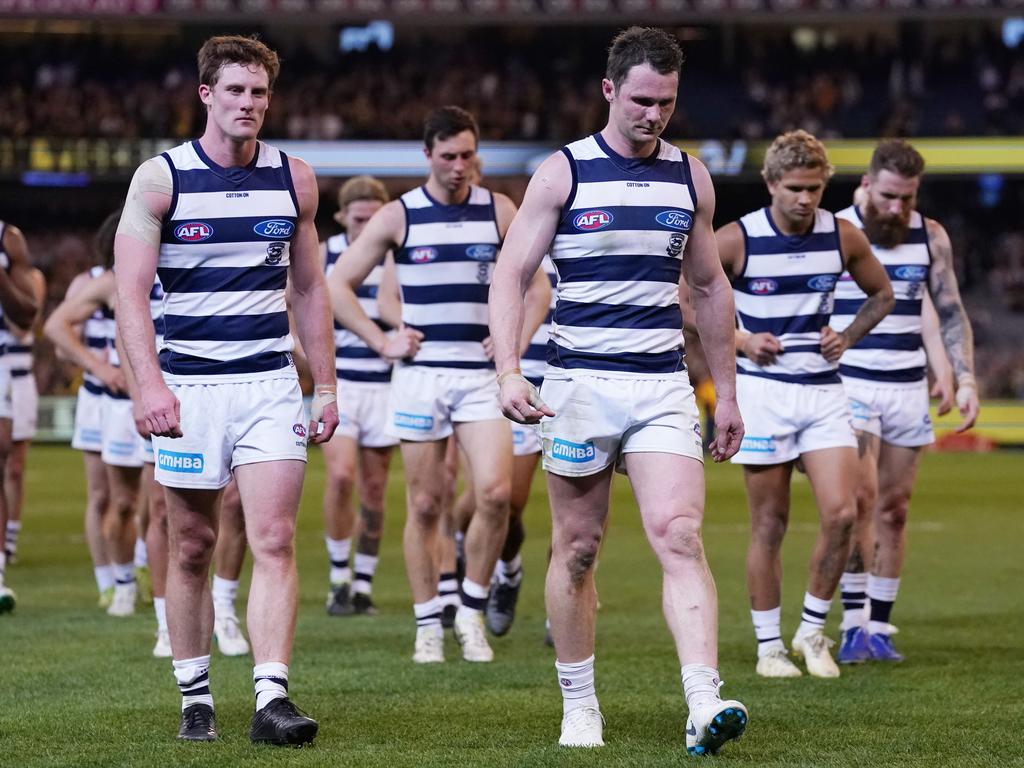 Dangerfield leads the Cats off after the loss.