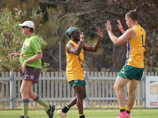 Papunya player Braydon Wiley (right) is concerned the CAFL's community competition will be axed in 2023. Picture: Supplied.