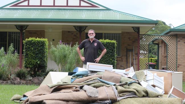 John Fitzgerald outside his home in Mullumbimby which was flooded this week. Picture: Liana Boss