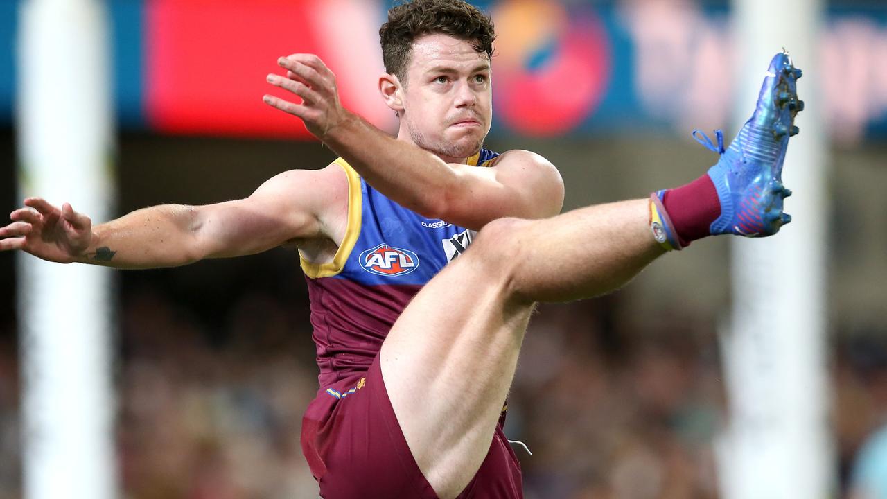 BRISBANE, AUSTRALIA - AUGUST 21: Lachie Neale of the Lions kicks the ball during the round 23 AFL match between Brisbane Lions and West Coast Eagles at The Gabba on August 21, 2021 in Brisbane, Australia. (Photo by Jono Searle/AFL Photos/via Getty Images)