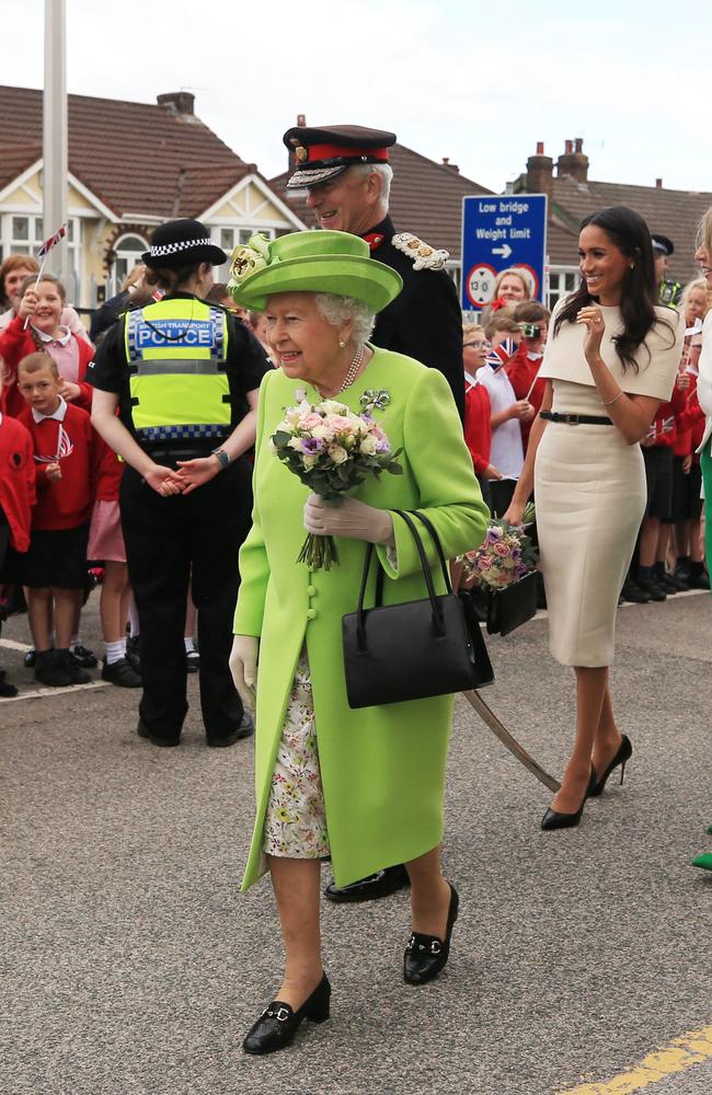 Queen Elizabeth and Meghan greet the crowds after arriving by Royal Train to open the Mersey Gateway Bridge near Liverpool, England on June 14, 2018. Picture: Peter Byrne – WPA Pool/Getty Images