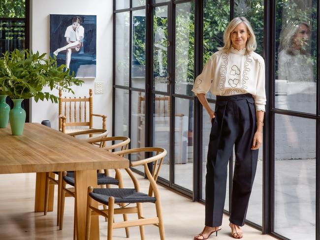 EMBARGO FOR WISH MAGAZINE. 07 FEBRUARY 2025. Oroton creative director Sophie Holt, wearing Oroton clothing at home in Melbourne. Also shown: Clara Adolphs unnamed artwork (2018), Wishbone dining chair by Carl Hansen & Son from Cult Design.Sittings editor ABBY BENNETTHair and make-up STELLA TUProduction CASEY PIPPETPhotographer DEREK SWALWELL