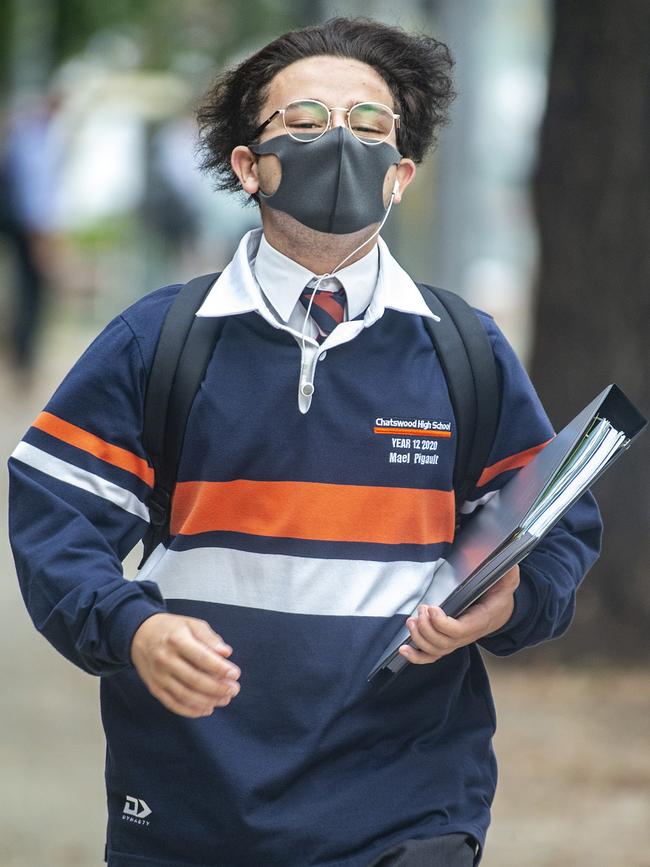 A student in Chatswood running towards class as he returns to school. Picture: Jenny Evans/Getty