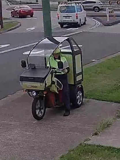 The postie then scans the package before filling out a collection card. Picture: Facebook