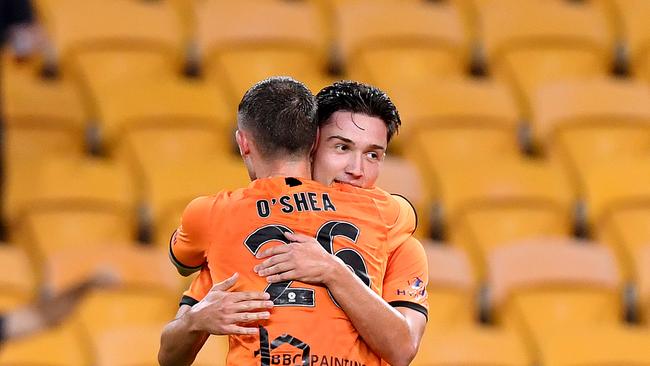 Mirza Muratovic of the Roar celebrates with team mate James O'Shea after scoring a goal against Adelaide United during Round 18 of the A-League. Picture: Bradley Kanaris/Getty Images.