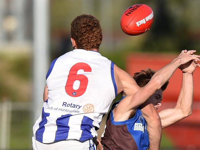 VAFA Premier Division 1: Ormond v Oakleigh at EE Gunn reserve. Oakleigh forward #6 Aaron Cloke crunches Ormond defender #49 Jack Short. Picture: Chris Eastman