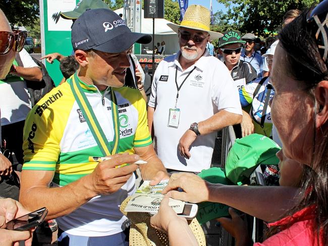 Simon Gerrans signs autographs for fans after winning the road race. Picture: Reece Homfray