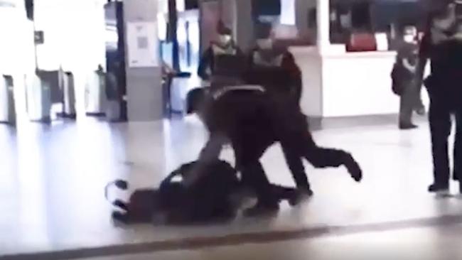 Police have settled out of court with a man who was sling tackled at Flinders Street Station during Covid protests.