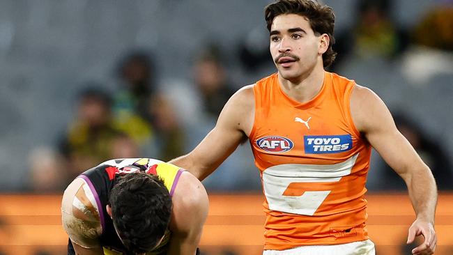 MELBOURNE, AUSTRALIA - JULY 14: Tim Taranto of the Tigers recovers from a Toby Bedford of the Giants tackle during the 2024 AFL Round 18 match between the Richmond Tigers and the GWS GIANTS at Melbourne Cricket Ground on July 14, 2024 in Melbourne, Australia. (Photo by Michael Willson/AFL Photos via Getty Images)