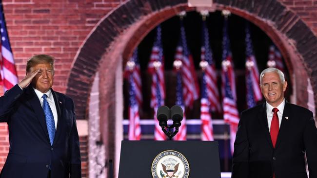 US President Donald Trump joins Vice President Mike Pence on stage as Mr Pence wraps his speech. Picture: Saul Loeb/AFP