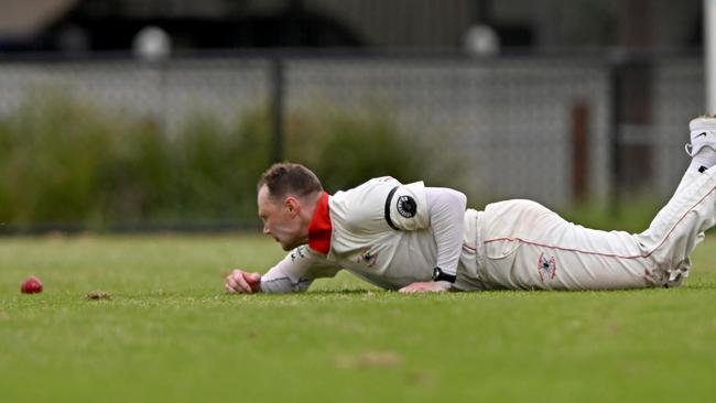 West Coburg’s Michael Rosendale goes to ground to collect this one. Picture: Andy Brownbill