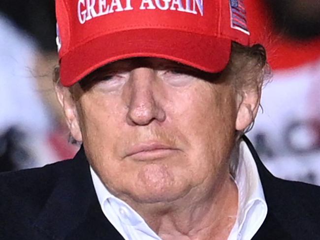 TOPSHOT - Former US President Donald Trump gestures as he speaks during a rally at the Canyon Moon Ranch festival grounds in Florence, Arizona, southeast of Phoenix, on January 15, 2022, - Thousands of Donald Trump supporters gathered in Arizona on Saturday to hear a raft of speakers claim the 2020 US election was stolen, with the former president expected to take to the stage as the headline act. (Photo by Robyn Beck / AFP)