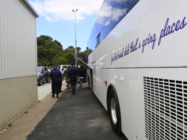 A group of passengers was ejected from the Carnival Legend and escorted on a bus by police.