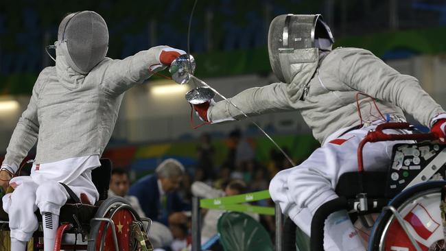 Polish fencer Adrian Castro (right) competes with China’s Yanke Feng at the Paralympic Games in Rio.