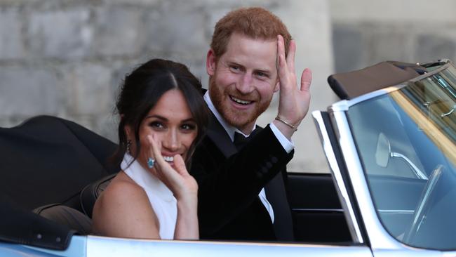 Prince Harry and Meghan wave as they leave Windsor Castle in May, 2018. Picture: Getty Images