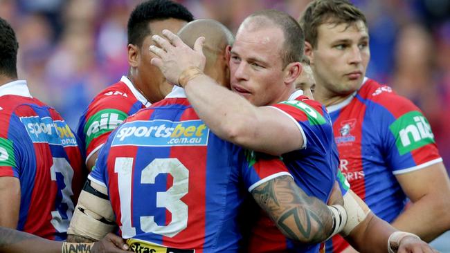 Knight's Beau Scott congratulated by Jeremy Smith after a strong tackle during the Canterbury Bankstown Bulldogs vs Newcastle Knights game at ANZ Stadium . Picture Gregg Porteous