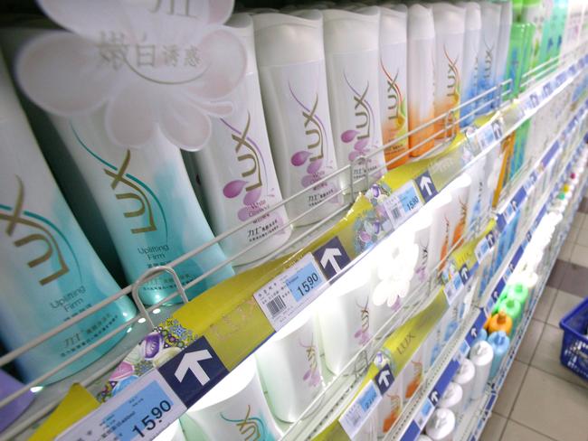 Bottles of Unilever Plc's Lux brand shampoo are arranged on a shelf in a supermarket in downtown Beijing, China, on Tuesday, October 10, 2006. Photographer: Stephen Shaver/Bloomberg News.