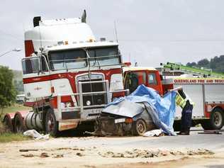 Police inspect a fatal two vehicle accident between a truck and a car near Hatton Vale on the Warrego Highway. . Picture: David Nielsen