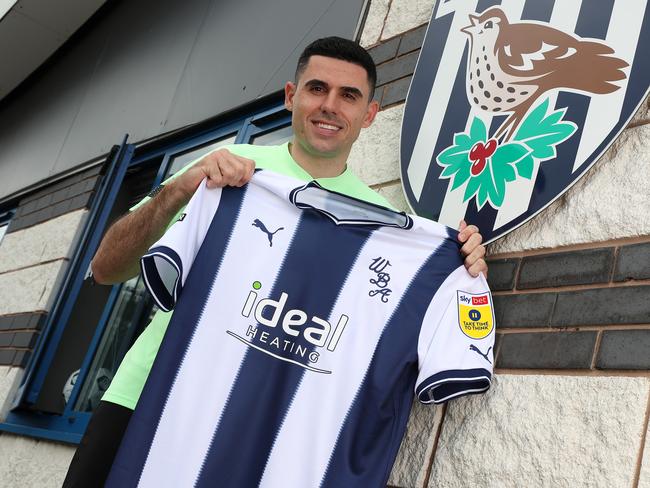 Tom Rogic poses with a West Bromwich Albion jersey outside the club’s training ground in Walsall. The star playmaker is walking a fine line towards World Cup selection. Picture: Adam Fradgley/West Bromwich Albion FC via Getty Images