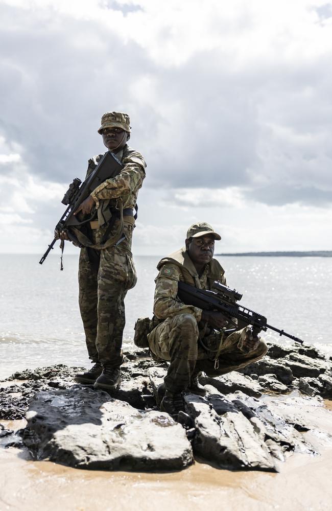 Cousins Private Francelia Rankin and Private Blake Djammarr Carter pictured on the beach of Milikapiti, Tiwi Islands. Picture: Dylan Robinson