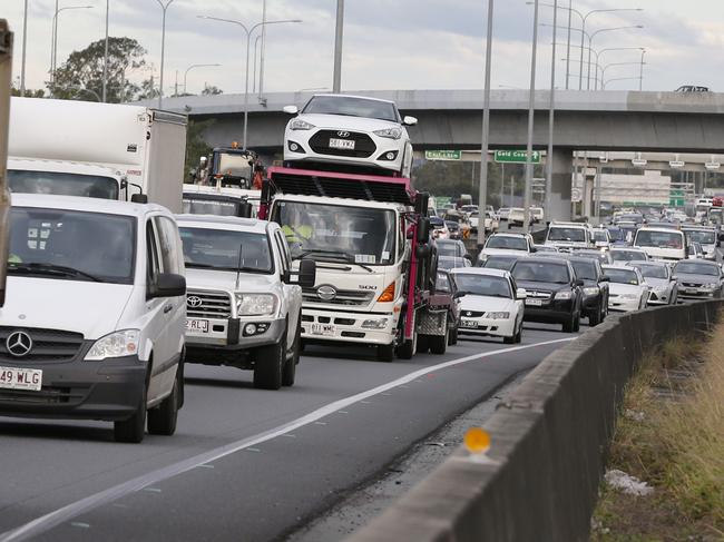 Traffic was brought to an almost standstill as Australian Prime Minister Malcolm Turnbull with Karen Andrews and Bert Van Manen at exit 31, Loganholme, announcemented a $215 million upgrade of the M1 to help stop congestion . . Photo: Jerad Williams