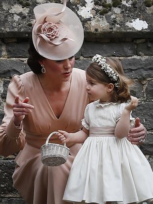 Catherine, Duchess of Cambridge speaks to Princess Charlotte after the wedding of Pippa Middleton and James Matthews. Picture: Getty