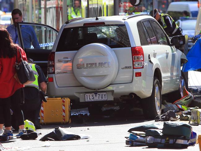 21/12/17 Police, Fire and Paramedics treat a number of pedestrians on the corner of Flinders Street and Elizabeth Street in Melbourne after a car is believed to have ploughed through a busy intersection. Aaron Francis/The Australian