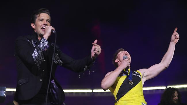 The 2017 AFL Grand Final between the Adelaide Crows and Richmond Tigers at the Melbourne Cricket Ground. The Killers lead singer Brandon Flowers with Jack Riewoldt. Picture: Alex Coppel.