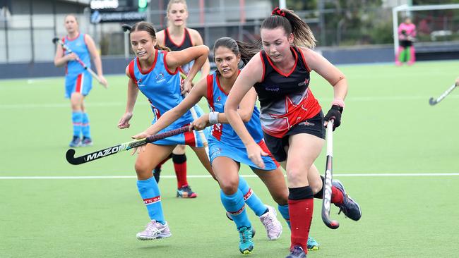 Cairns Hockey. Saints v Souths women on Rainforest Turf. Saints’ Liv McArthur and Michelle Senior chasing down Souths Caitlyn Whipp. PICTURE: STEWART McLEAN