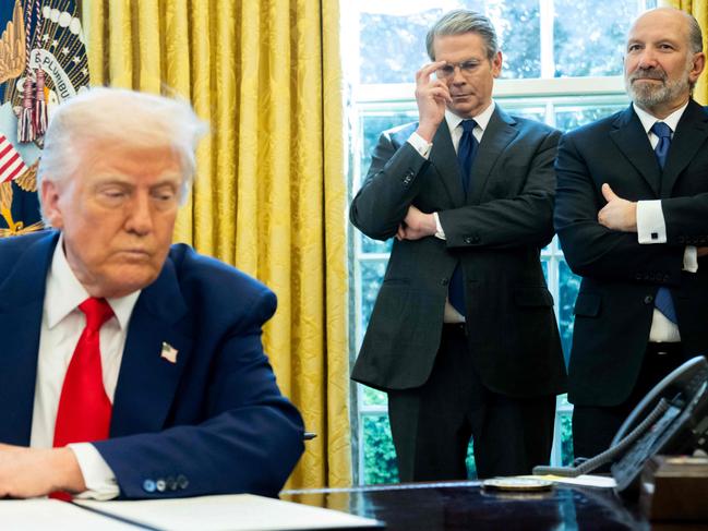 President Donald Trump with US Treasury Secretary Scott Bessent and Commerce Secretary Howard Lutnick, right, in the White House. Picture: AFP