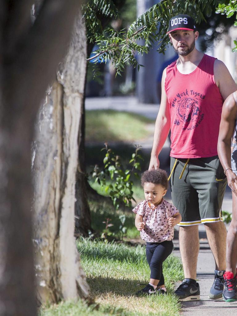 Serena Williams and her husband Alexis Ohanian enjoy an afternoon walk with their 1-year-old daughter Alexia Olympia. Serena's daughter looked seriously cute, toddling her way down the footpath, wearing Nike sneakers like her Mummy. Picture: MediaMode