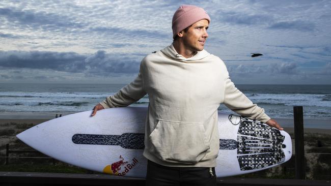 Pro surfer Julian Wilson back in his hometown in Coolum Beach. Picture: Lachie Millard