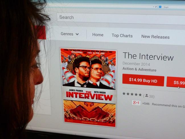 In this December 24, 2014 photo illustration a woman looks at the Google Play purchase page for the Sony film "The Interview," in Washington, DC. Entertainment giant Sony released "The Interview" -- a movie that outraged North Korea by lampooning dictator Kim Jong-Un -- online for US viewers on Wednesday. The madcap comedy became available for rent in the United States from 1800 GMT on several platforms, one day before its Christmas Day limited theatrical release. It was to be distributed on Google's YouTube for $5.99, on the Google Play app for Android devices and on a dedicated website, seetheinterview.com, after a brief announcement from the studio. The future of the film had been in doubt after Sony said last week that it was canceling the release following a hacking attack on its corporate network and threats against moviegoers. AFP PHOTO / STF