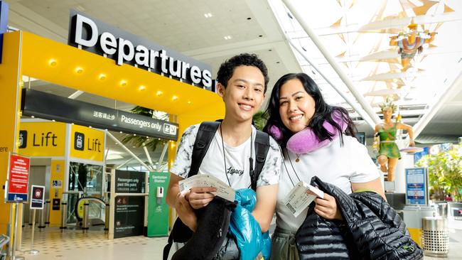 Jayvier and Michelle Keioskie about to fly from Brisbane International Airport to Japan to celebrate Jayvier's birthday. Picture: Richard Walker