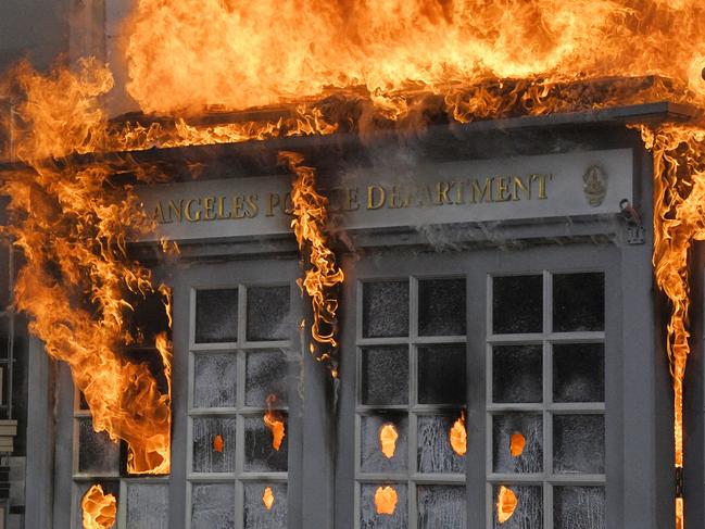 A Los Angeles Police Department kiosk ablaze in The Grove shopping centre. Picture: AP