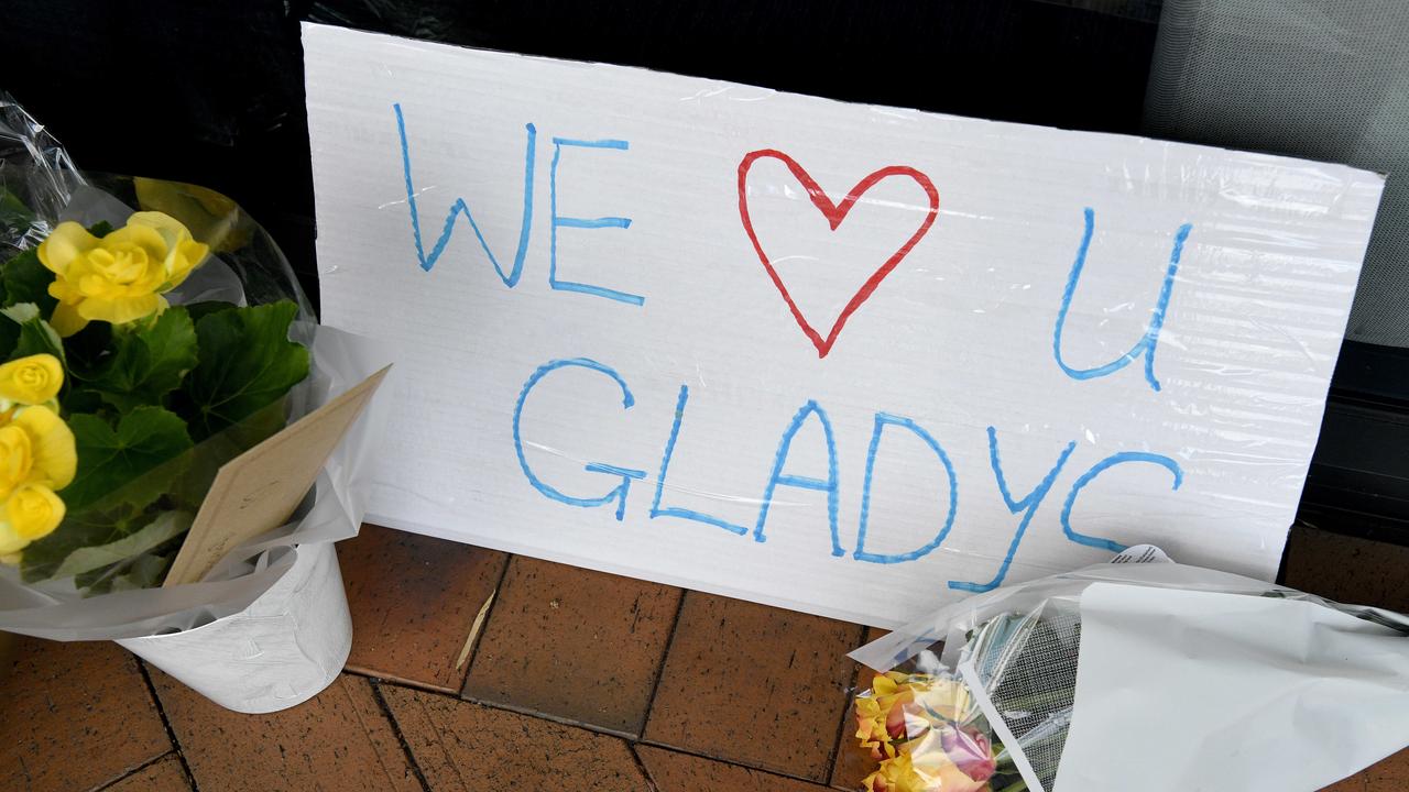 Flowers and signage are left outside Gladys Berejiklian’s office. Picture: NCA NewsWire/Bianca De Marchi