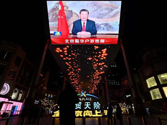 A large screen shows Chinese President Xi Jinping delivering a speech ahead of the New Year's eve celebrations in Beijing on December 31, 2024. Picture: AFP