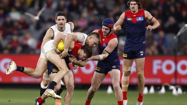 Patrick Cripps applies a strong tackle on Demon Jack Viney. Picture: Darrian Traynor/Getty Images