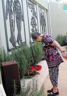 Cooinda resident Gloria Parker, who had five uncles who served for Australia, laying a wreath at the new memorial on behalf of Cooinda&#39;s Zane Lodge.